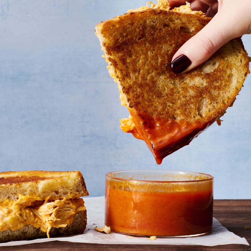 buffalo chicken mixture in a grilled cheese