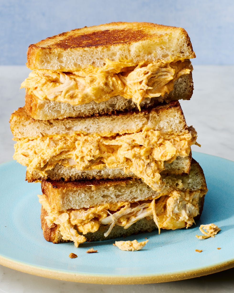 buffalo chicken mixture in a grilled cheese