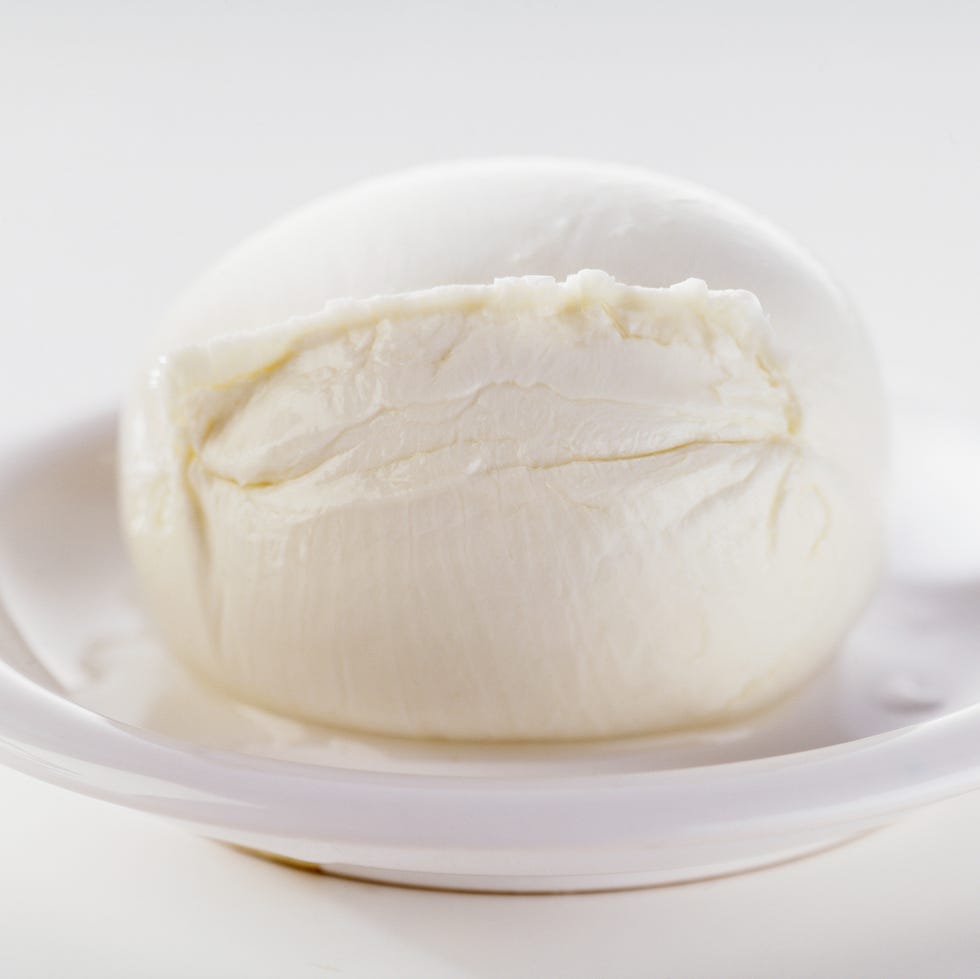 Buffalo mozzarella, on white dish, close-up buffalo mozzarella, on white dish,