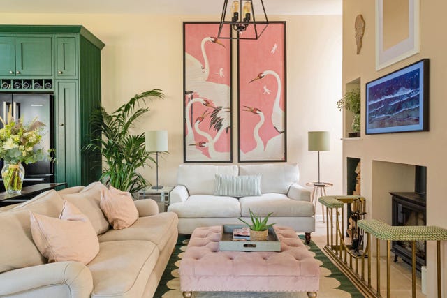 room with sofas and paintings