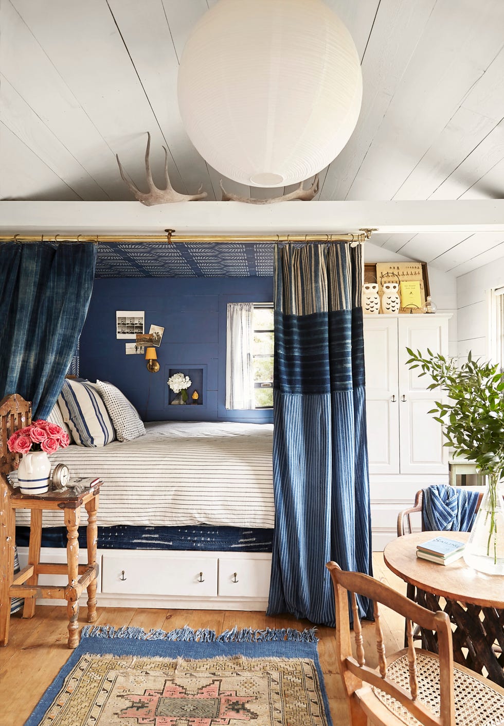 a built in bed nook in a blue and white decor