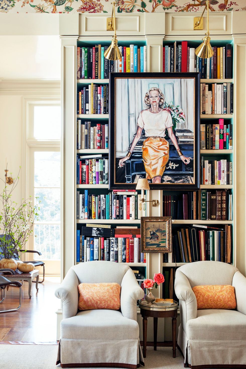 colorful bookshelf with paintings