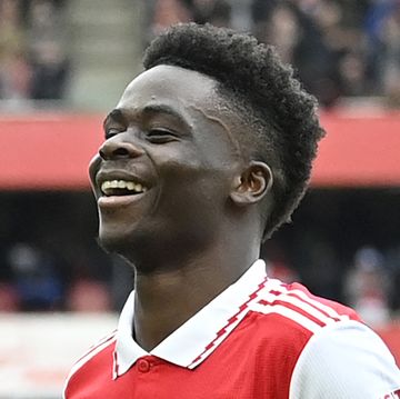 bukayo saka celebrates scoring a goal for arsenal