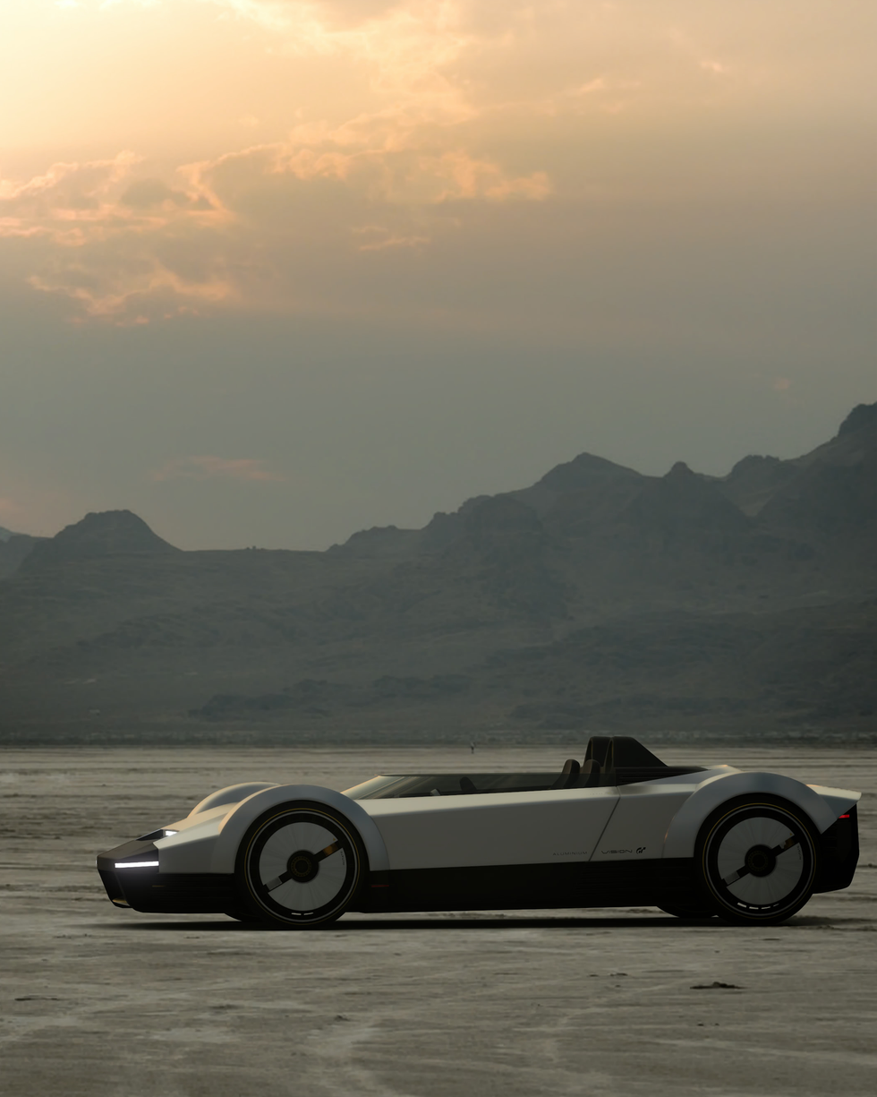 a white sports car parked on a beach with mountains in the background