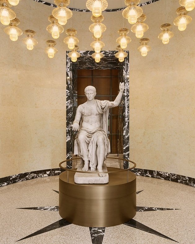 interior space featuring classical sculpture and decorative lighting interior space featuring classical sculpture and decorative lighting