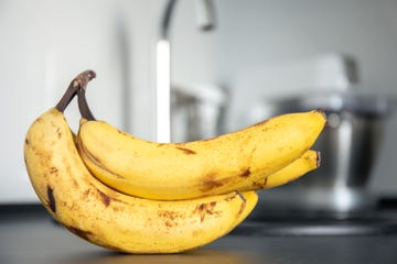 bunch of bananas on kitchen table, close up