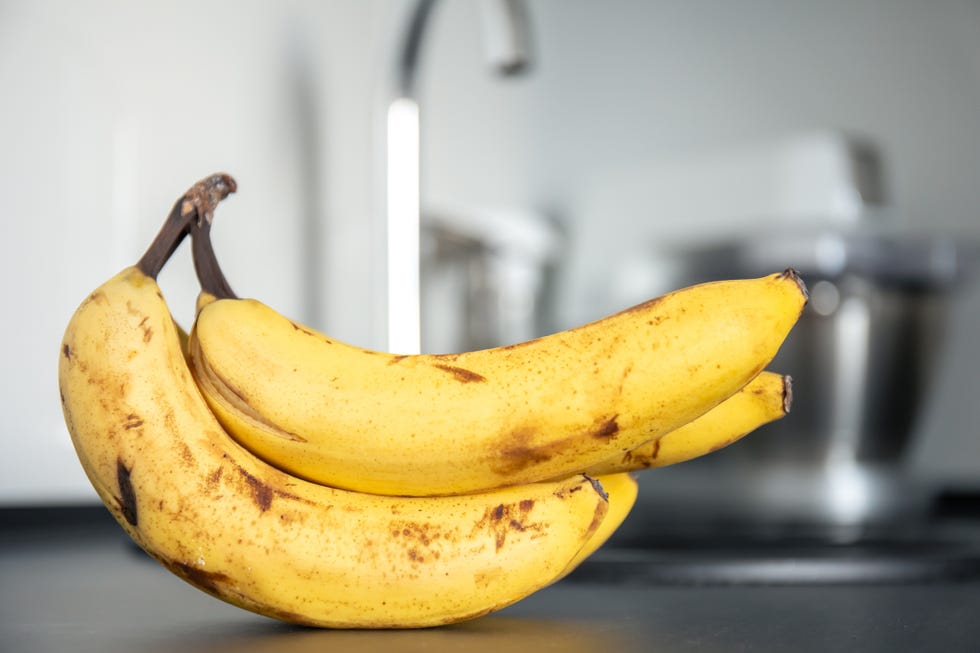 bunch of bananas on kitchen table, close up