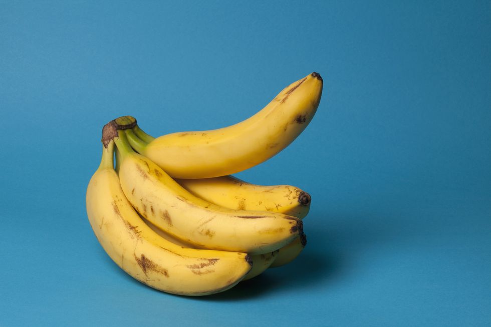 healthy living a bunch of bananas with a single banana sticking up, suggestive of an erection