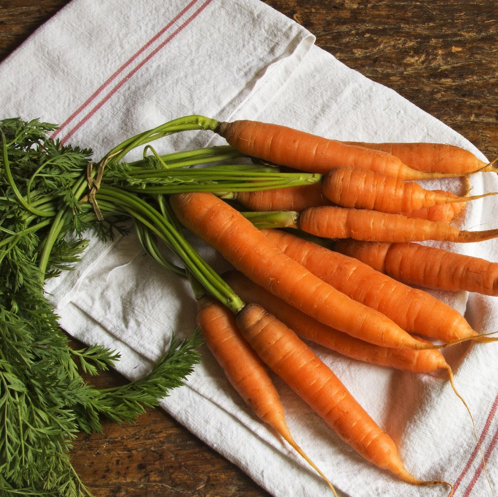 bunch of organic carrots on a dishcloth still life