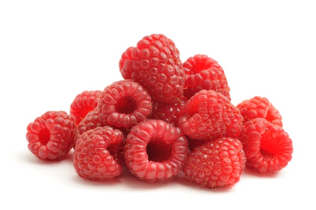 bunch of raspberries on white background