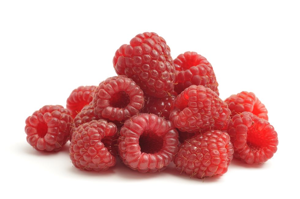 bunch of raspberries on white background