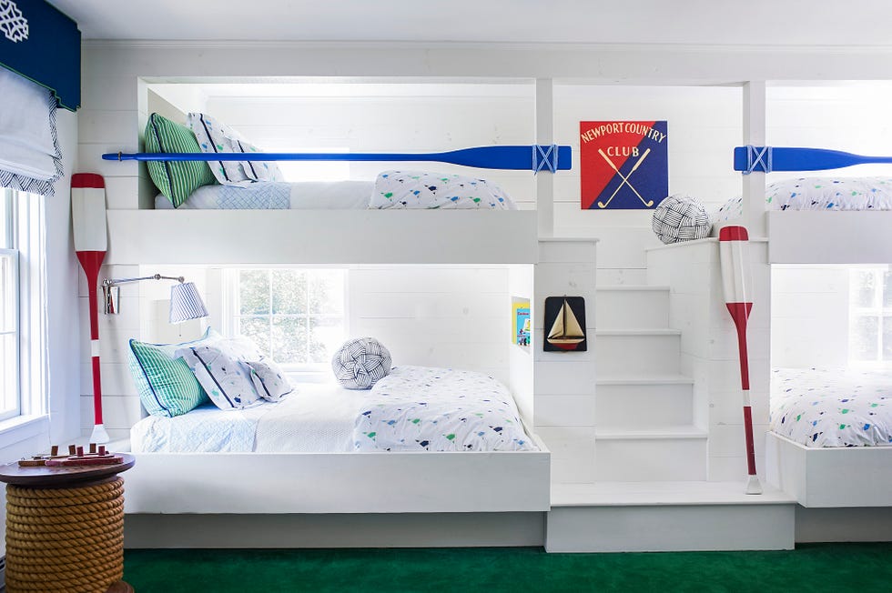 child's bedroom with bunk beds boat oar railing