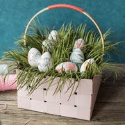 basket with eggs and grass and a bunny made of popsicle sticks basket with eggs and grass and a bunny made of popsicle sticks