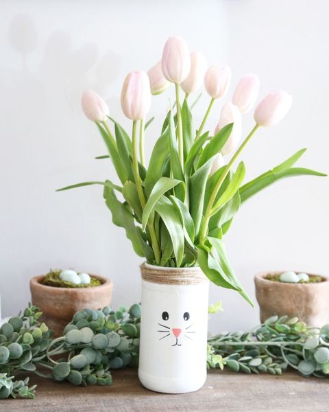 vase of flowers with bunny's face on it