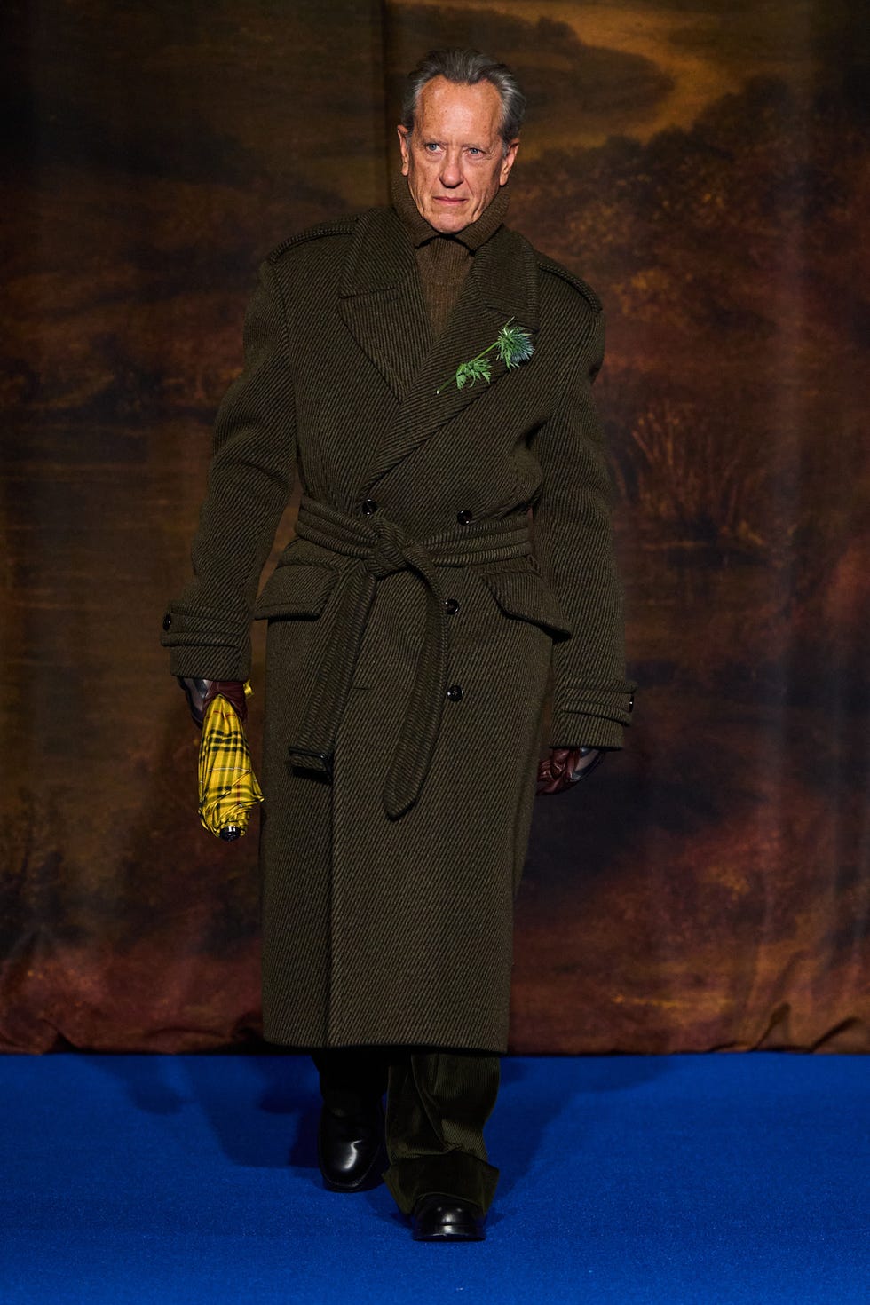 fashionable figure in an elegant coat and unique accessories