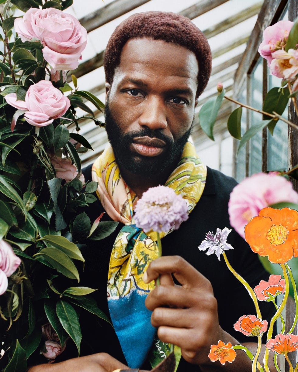 person surrounded by colorful flowers holding a floral bouquet