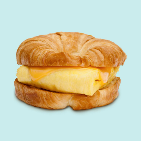 burger king egg and cheese croissantwich on a blue background