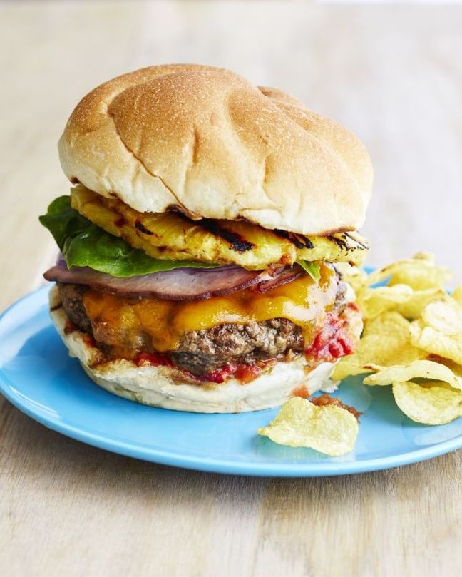 hawaiian burgers with pineapple on plate with chips
