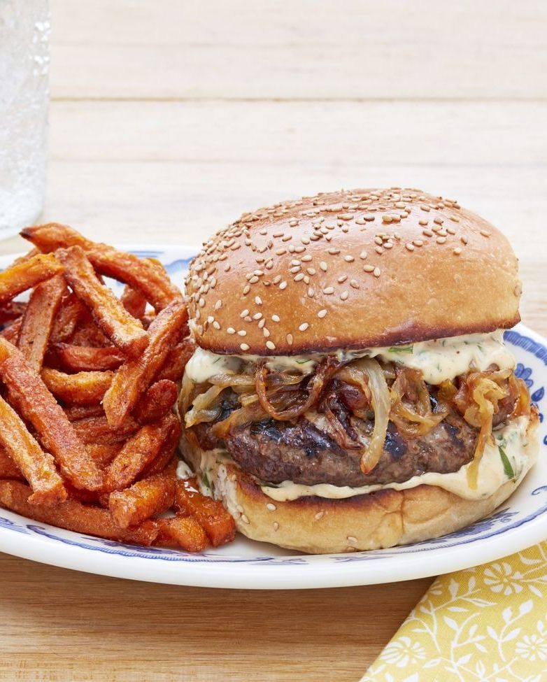 salisbury steak burgers with onions and sweet potato fries on the side