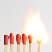 Burning row of matches isolated