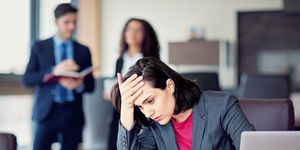 burnout businesswoman under pressure in an office