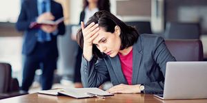 burnout businesswoman under pressure in an office