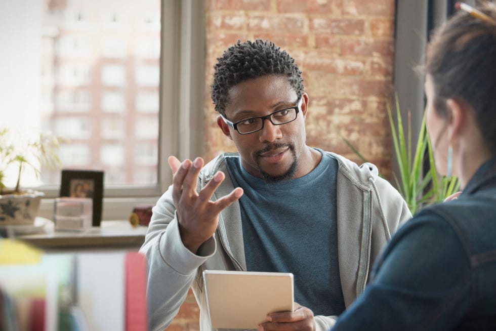 man confiding in an office