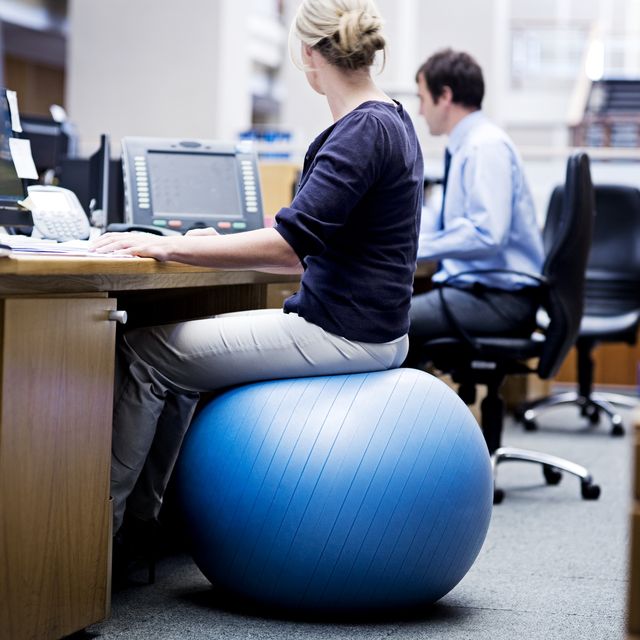 sitting on a yoga ball in the office