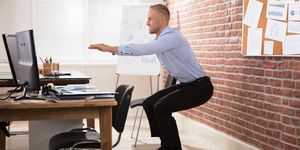 businessman doing exercise in office