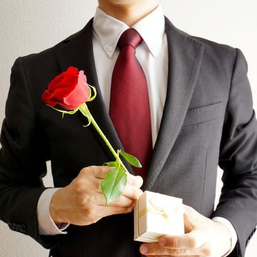 businessman with red rose flowers