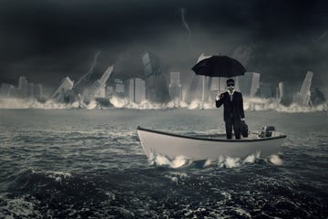 businessman with umbrella in boat