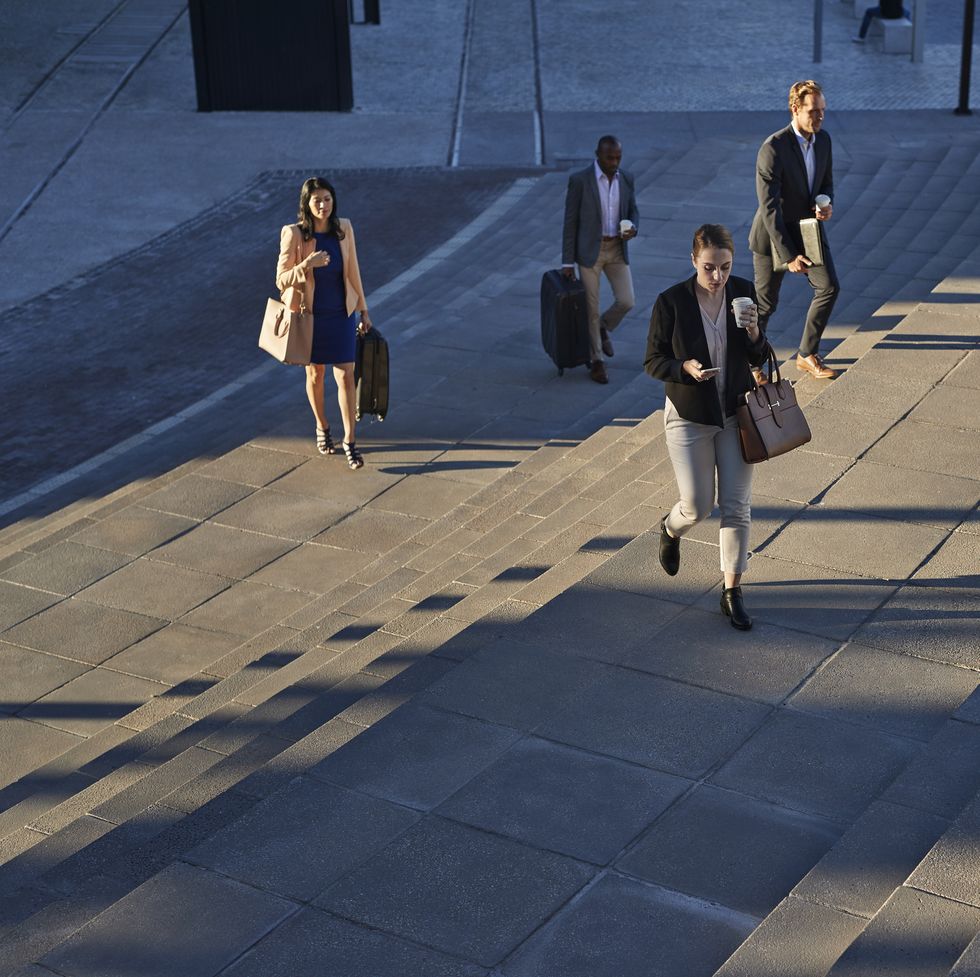 businesspeople walking on staircase outside