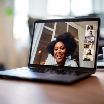 businesswoman having a video call meeting with her team