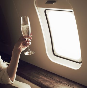 businesswoman relaxing aboard private jet