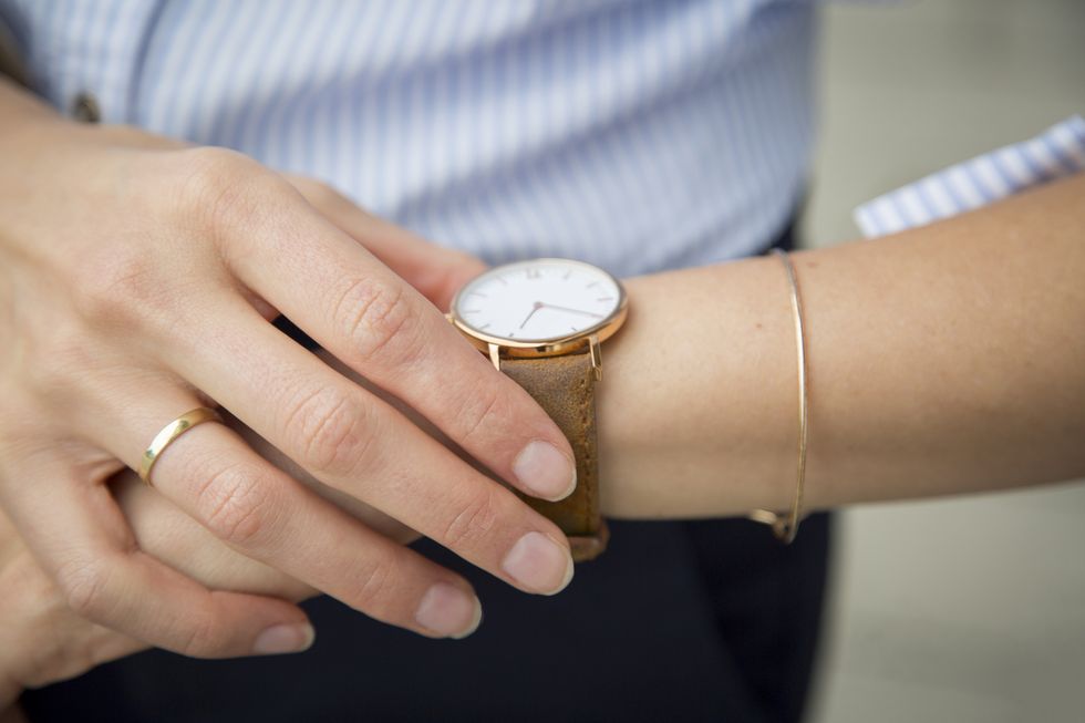 businesswoman wearing wrist watch, close up