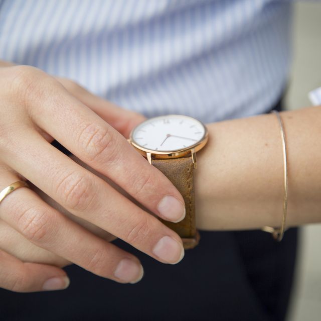 businesswoman wearing wrist watch closeup