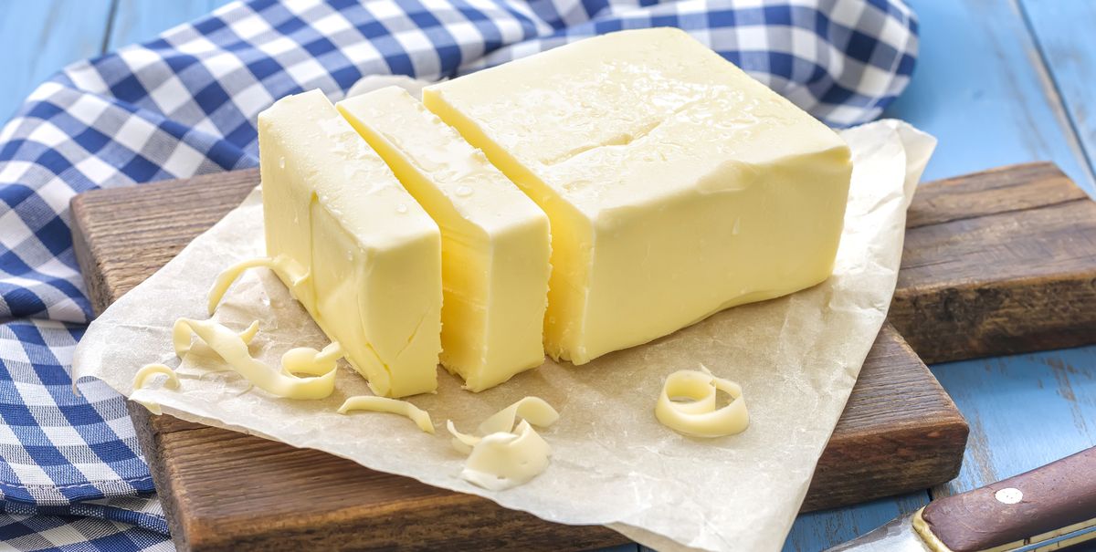 stick of butter on a wooden tray