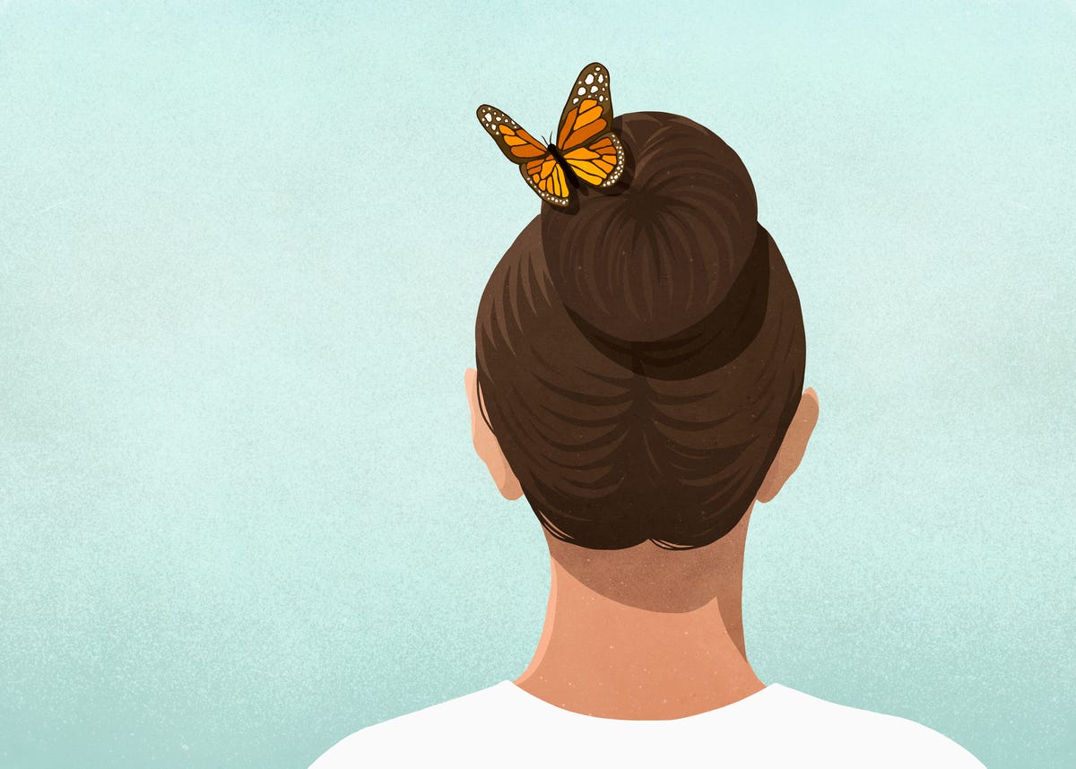 butterfly in womans hair