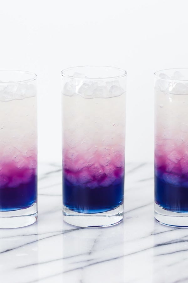 Highball glass, Drink, Liquid, Tumbler, Italian soda, Non-alcoholic beverage, Distilled beverage, Liqueur, Purple rain, Glass, 