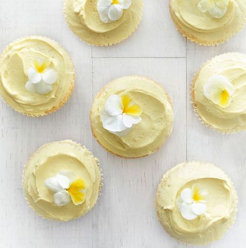 yellow buttermilk cupcakes with white flowers on top