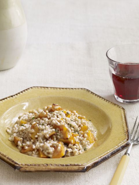 barley risotto with butternut squash on a plate with a fork
