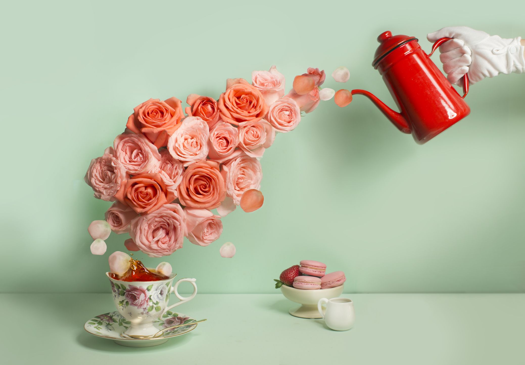 https://hips.hearstapps.com/hmg-prod/images/buttler-pouring-a-stream-of-roses-into-tea-cup-royalty-free-image-1659379799.jpg