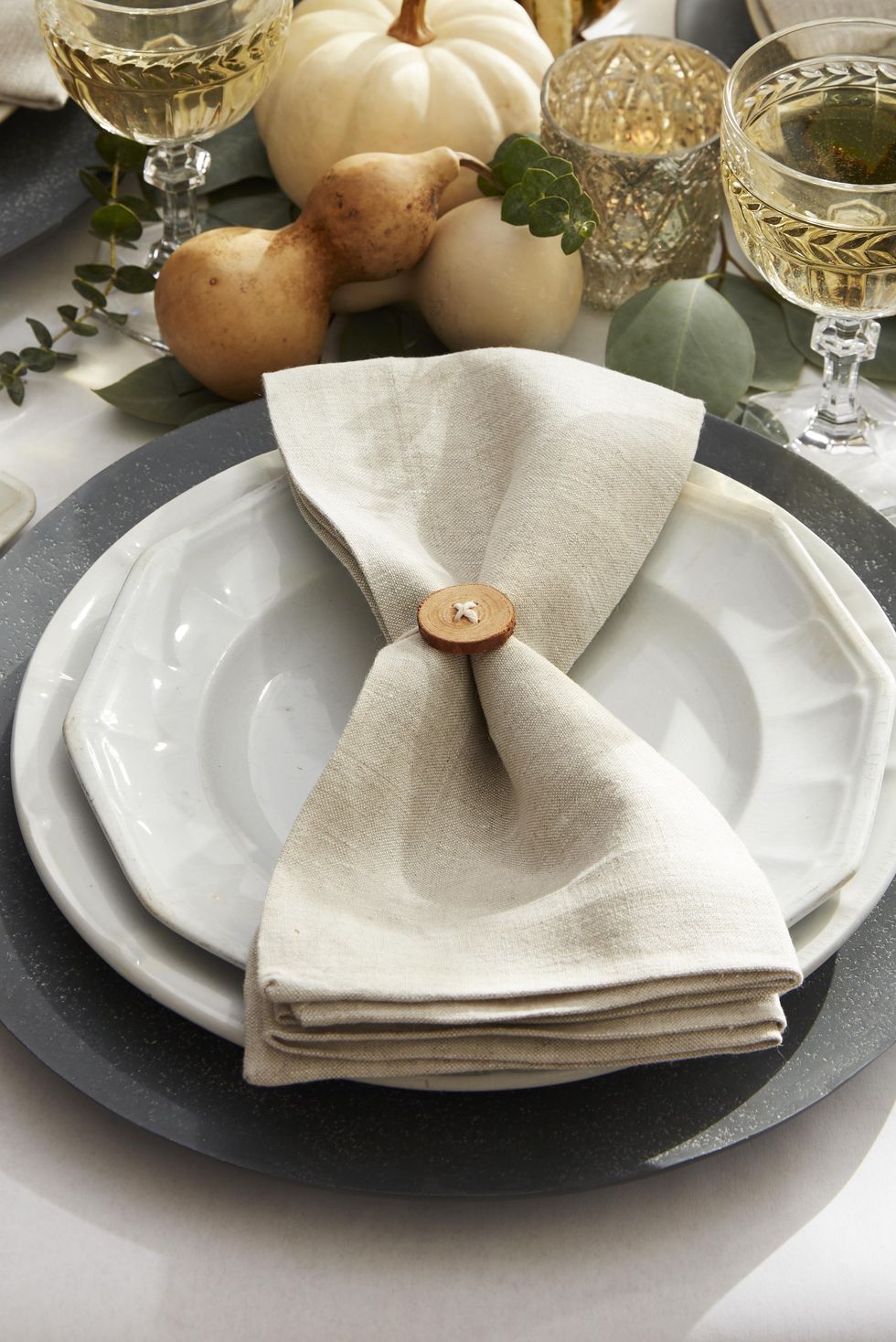 wood button napkin ring on a neutral table setting