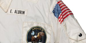 buzz aldrin jacket from apollo 11 closeup on name and mission patch and us flag