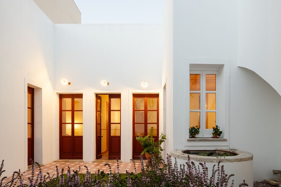 Modernist on the outside and minimalist on the inside, a century-old house in Faro, Portugal