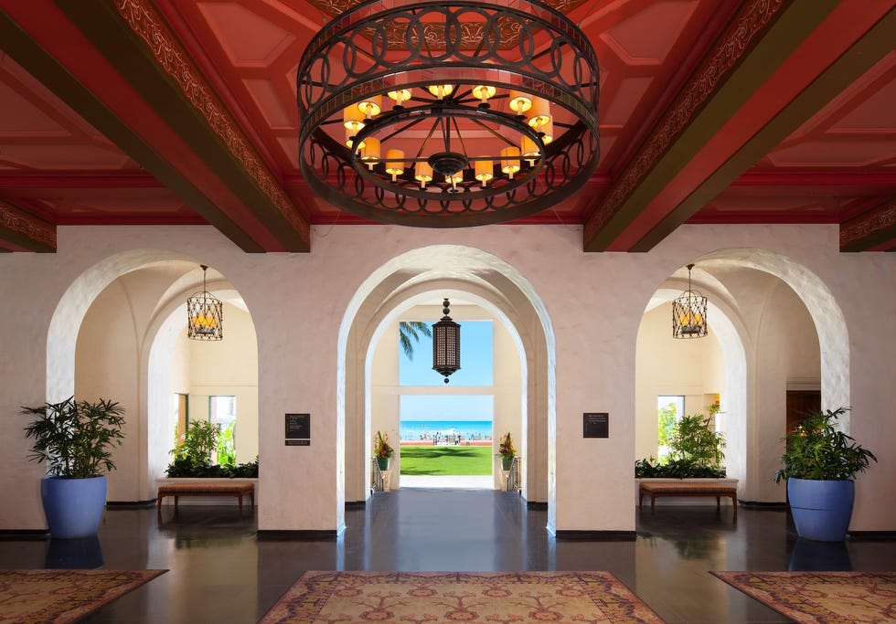 Entrance area of a building with a view of the beach.