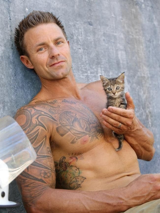 Tattoo, Facial hair, Cat, Barechested, Arm, Felidae, Muscle, Beard, Chest, Whiskers, 