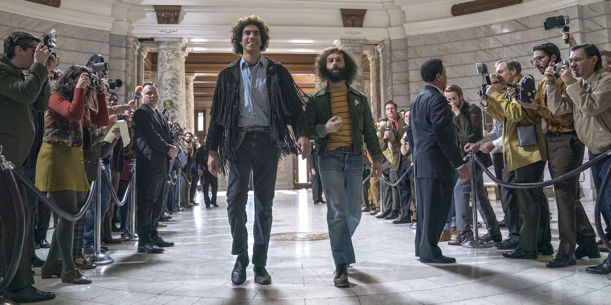 the trial of the chicago 7 l to r sacha baron cohen as abbie hoffman,  jeremy strong as jerry rubin in the trial of the chicago 7 cr niko tavernisenetflix © 2020