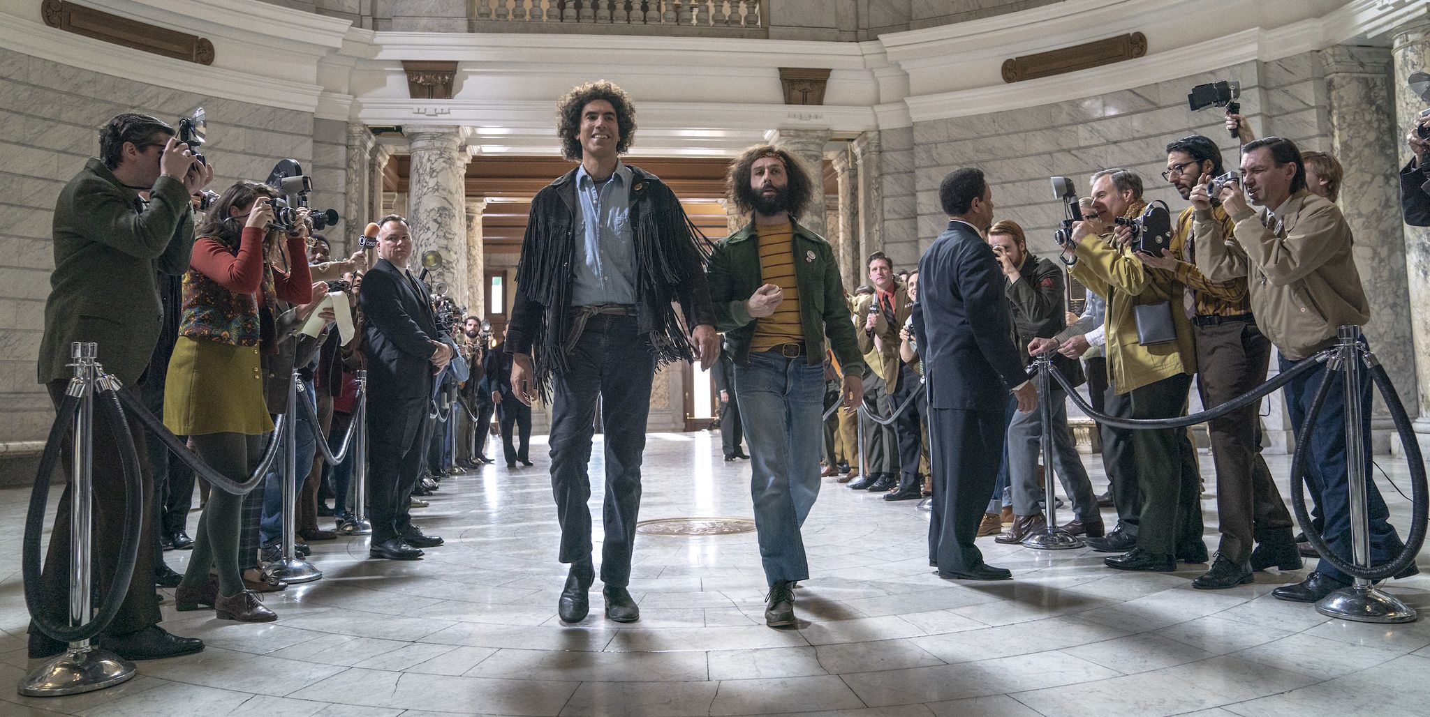 the trial of the chicago 7 l to r sacha baron cohen as abbie hoffman,  jeremy strong as jerry rubin in the trial of the chicago 7 cr niko tavernisenetflix © 2020