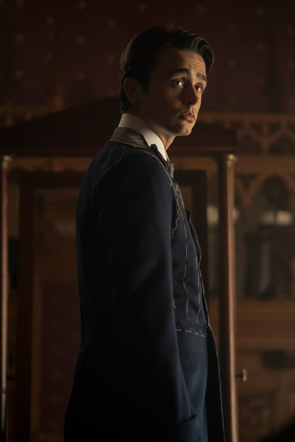 A person dressed in a partially finished formal suit A person dressed in a partially finished formal suit